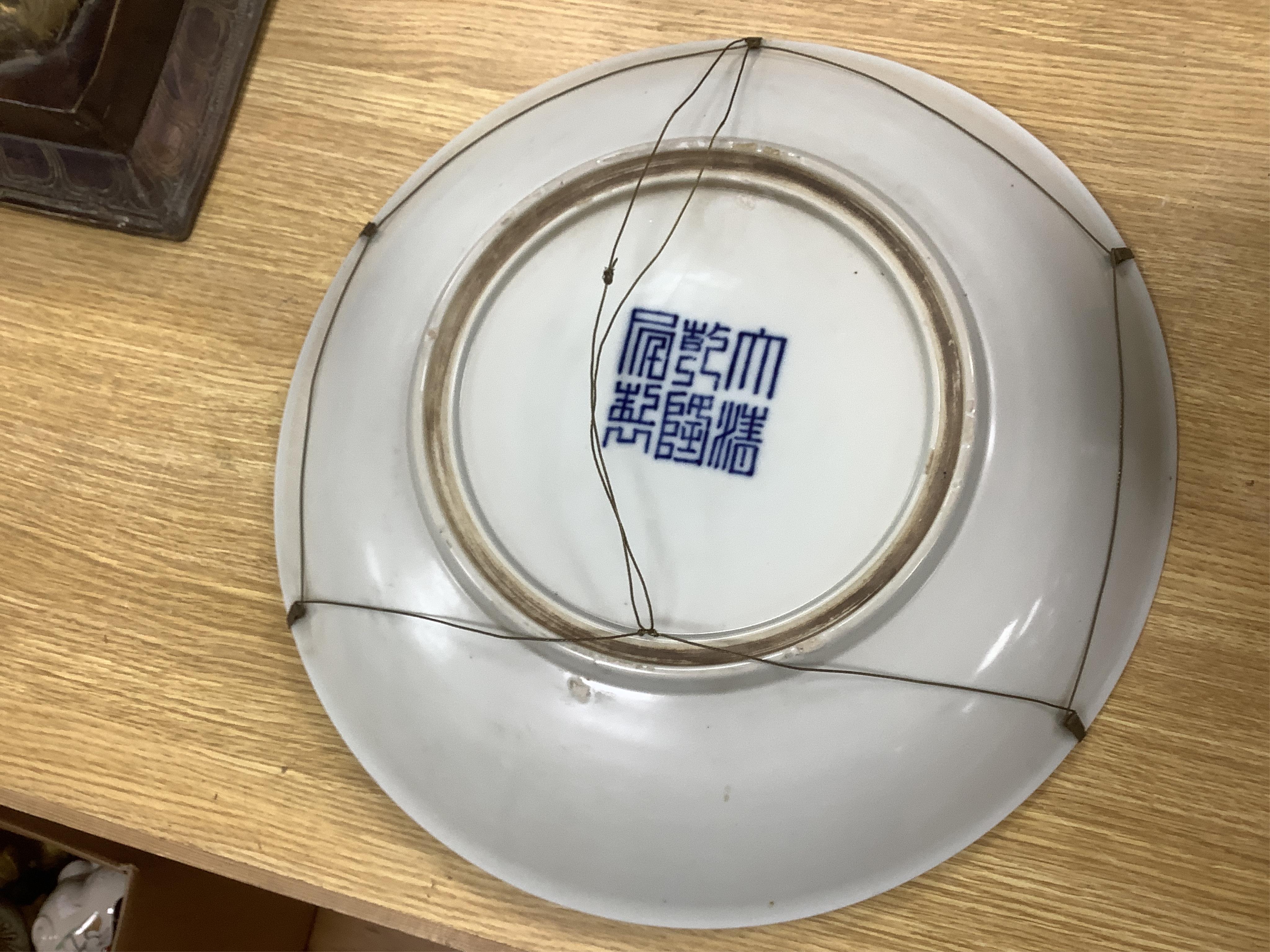 Two large Chinese blue and white chargers, largest 62cm diameter. Condition - good